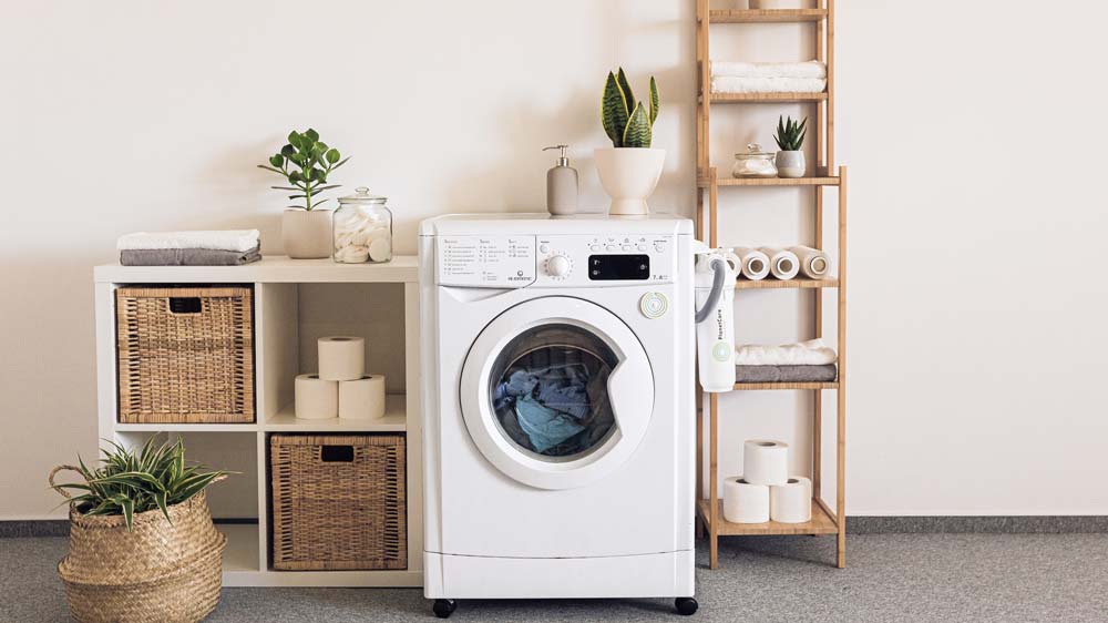 A laundry room with one white washer/dryer